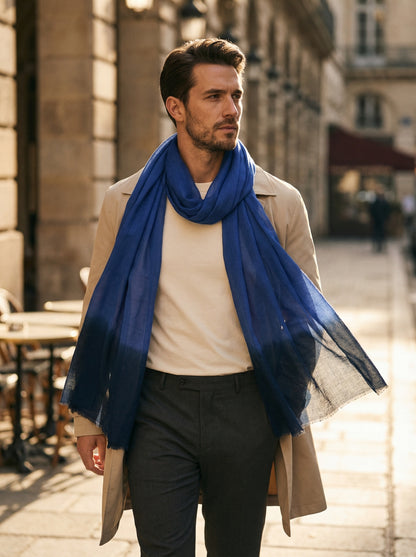 Man wearing indigo Moroccan Tagelmust as a breathable desert headscarf, lightweight safari scarf built for Sahara trekking and dust protection.