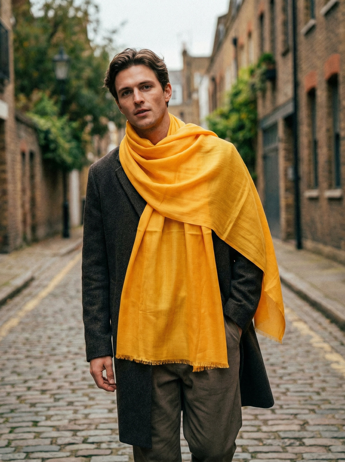 Man wearing Sunglow Orange Moroccan Tagelmust as a breathable desert headscarf, lightweight safari scarf built for Sahara trekking, dust protection, and hot weather overlanding.