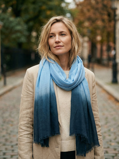 Sky blue Tagelmust styled as a lightweight travel scarf for women, Touareg inspired Moroccan headscarf ideal for safari adventures and warm desert climates.
