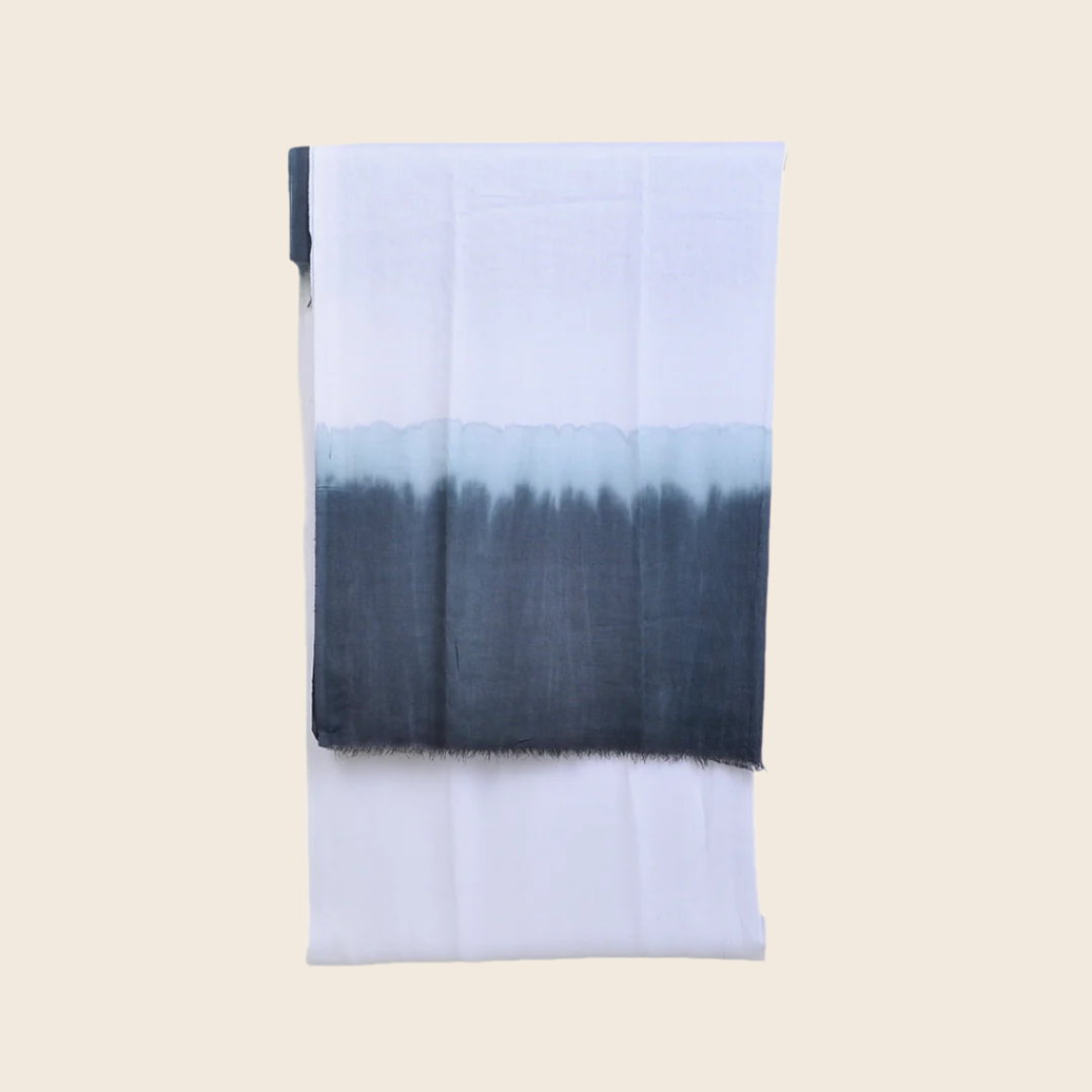 Ghost White Soaked Tagelmust scarf – crisp white fading to ice‑blue and charcoal grey, sustainably sourced lightweight Moroccan headscarf ideal for nomadic travelers seeking white, blue, or grey scarves for hot‑weather, dry‑climate adventures.