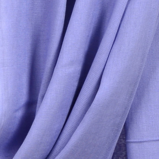 Close‑up of Vista Blue Soaked Tagelmust scarf fabric – soft lavender‑blue Moroccan headscarf, sustainably sourced lightweight weave ideal for nomadic travelers searching for lavender, periwinkle, or light‑blue scarves for hot‑weather, dry‑climate adventures.